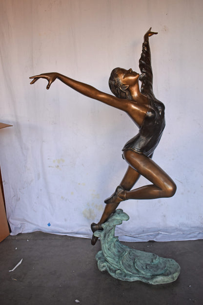 Ballet Dancer Performing on Stage Bronze Statue - Size: 45"L x 27"W x 71"H.