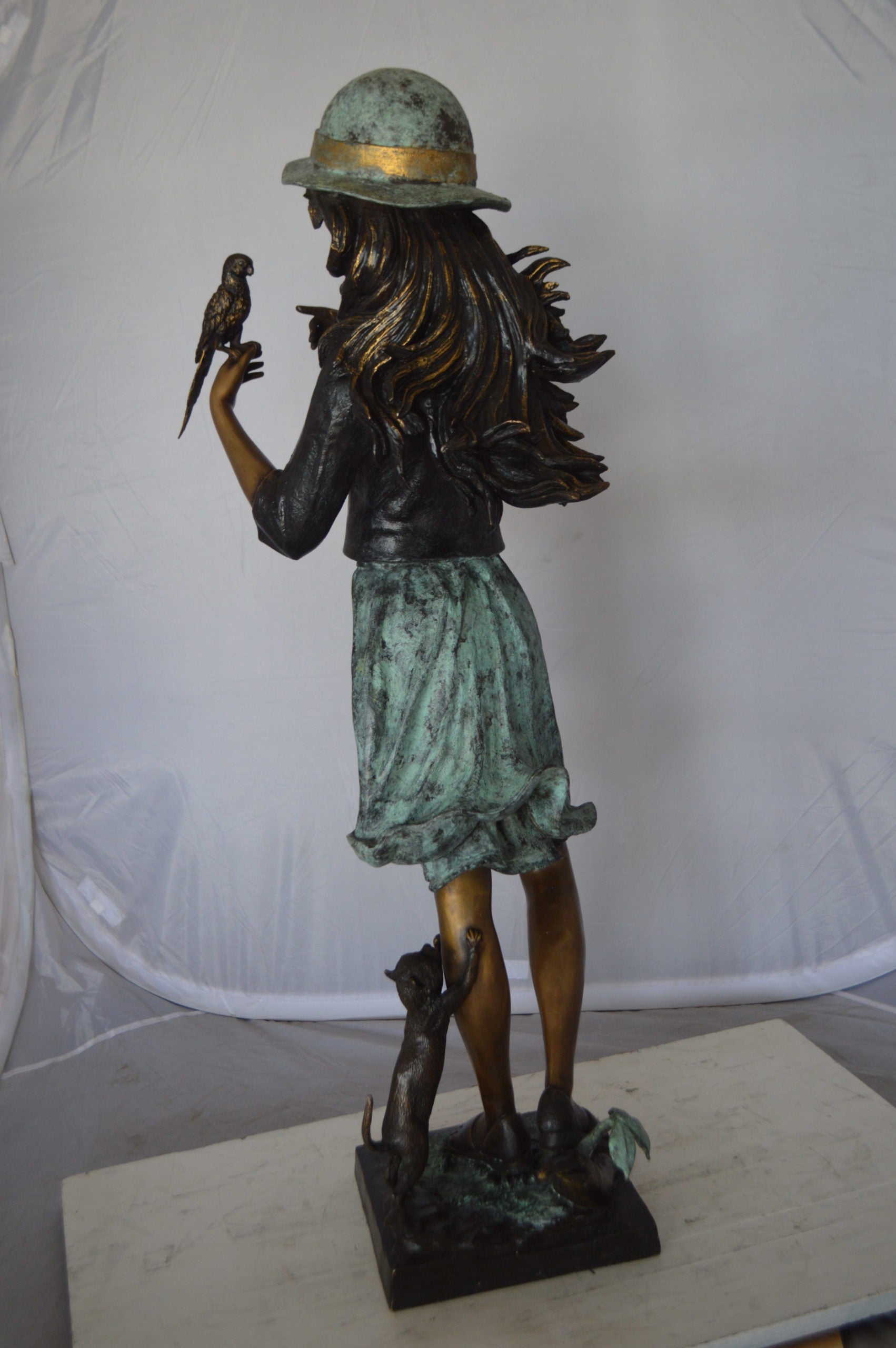 Standing girl with parrots Bronze Statue -  Size: 15"L x 16"W x 41"H. 