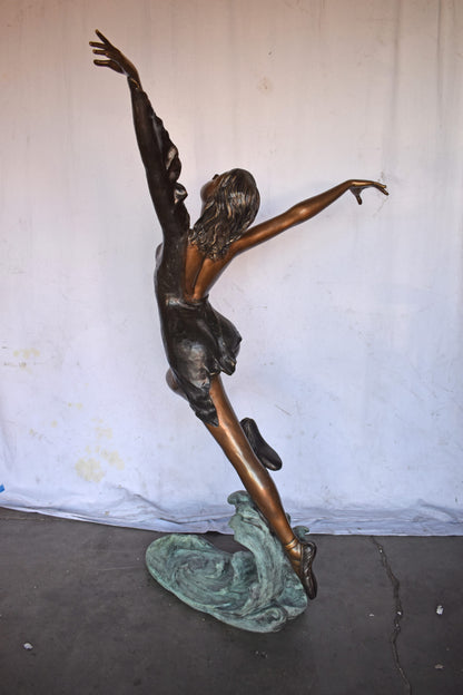 Ballet Dancer Performing on Stage Bronze Statue - Size: 45"L x 27"W x 71"H.