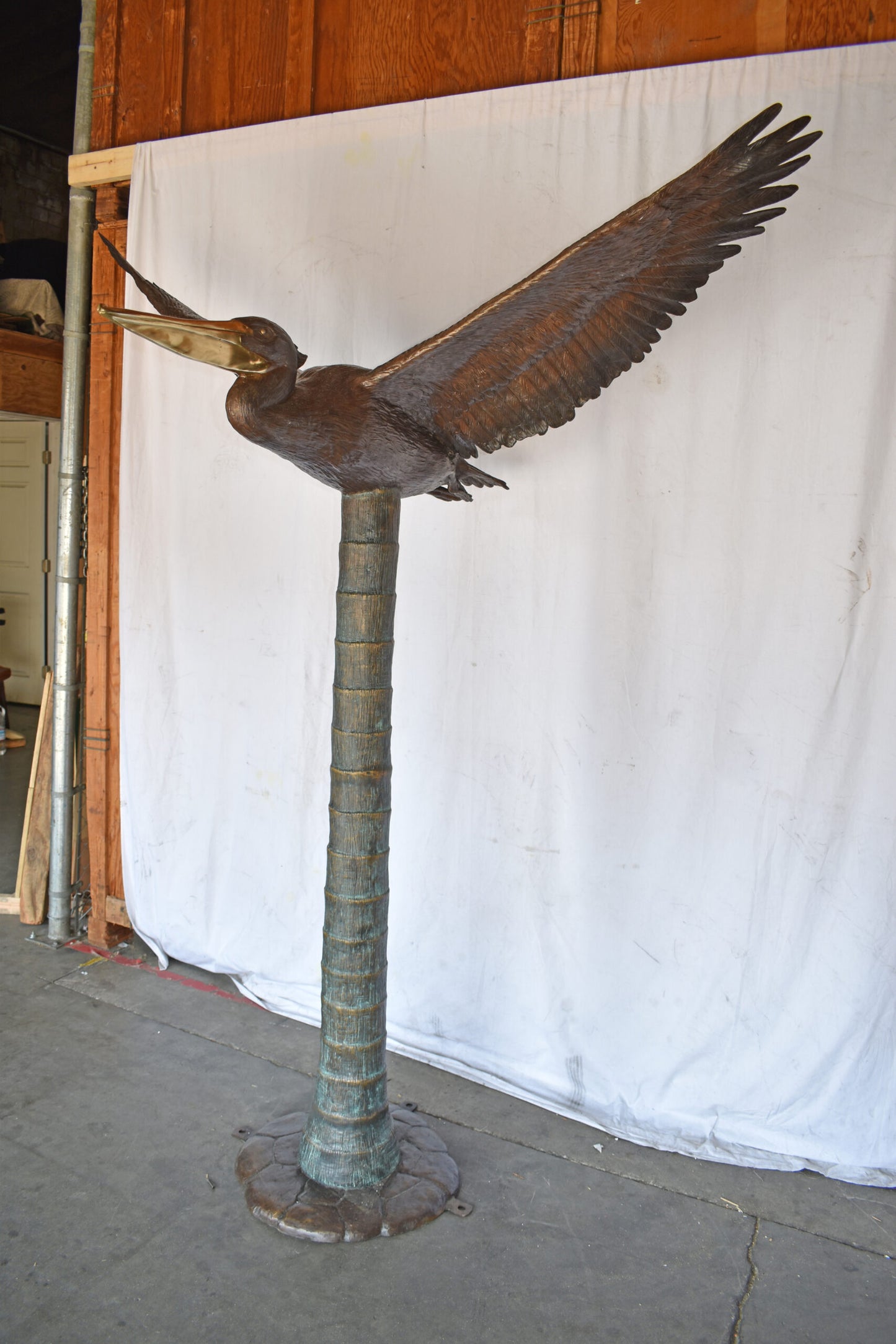 Life Size Pelican Flying Bronze Status - Size: 69"L x 45"W x 88"H.