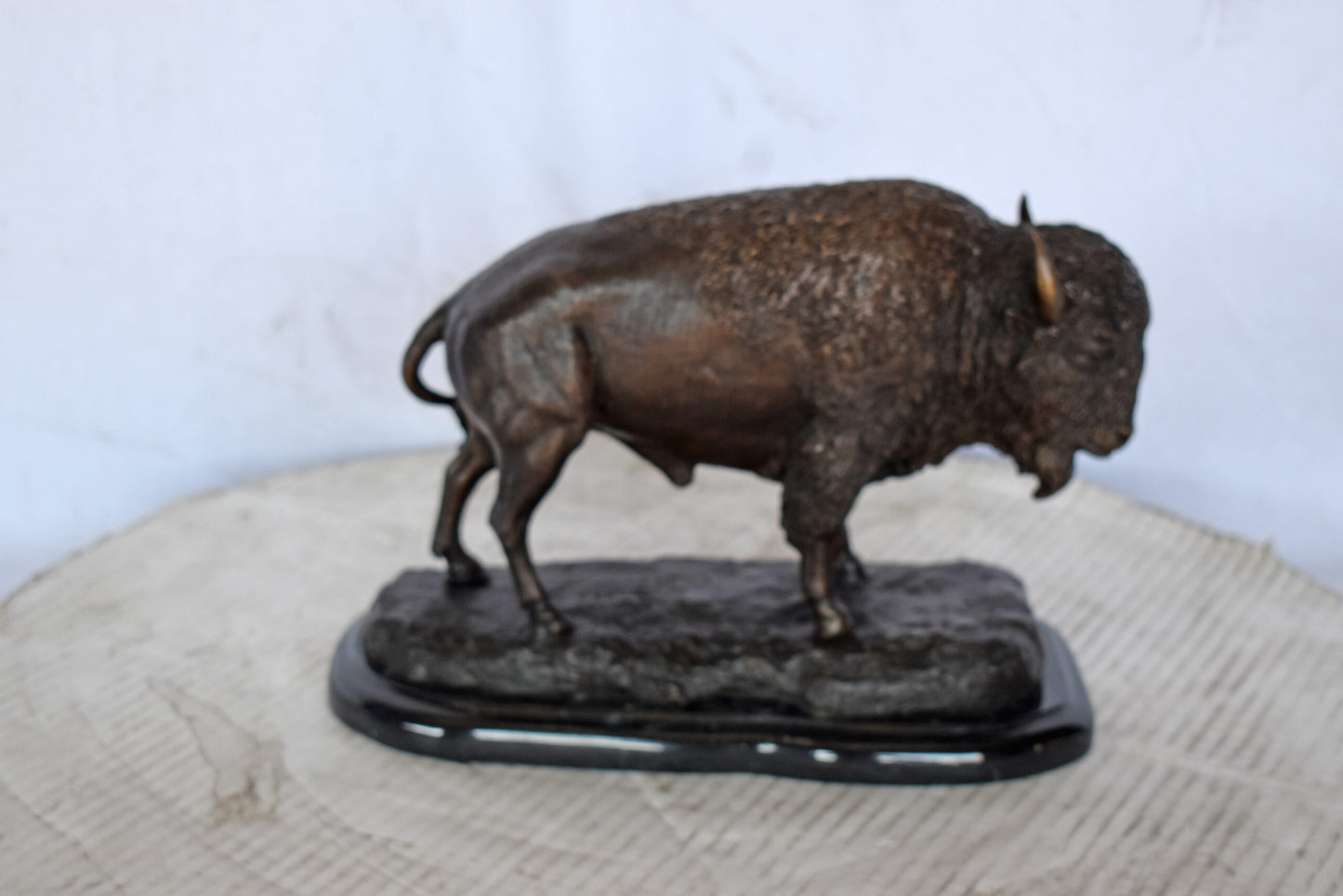 Bison standing and looking down Bronze Statue - Size: 11"L x 6"W x 8"H.