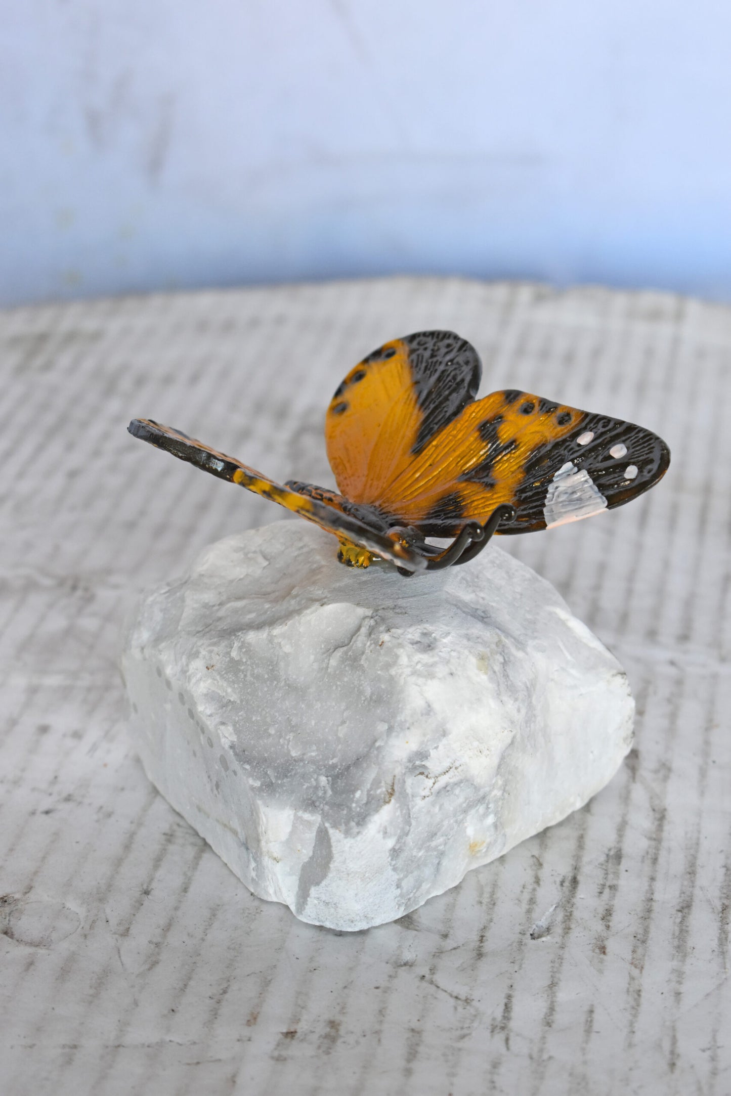 Orange Butterfly made of Bronze mounted on a rock - Size: 5"L x 5"W x 4"H.