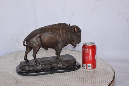 Bison standing and looking down Bronze Statue - Size: 11"L x 6"W x 8"H.