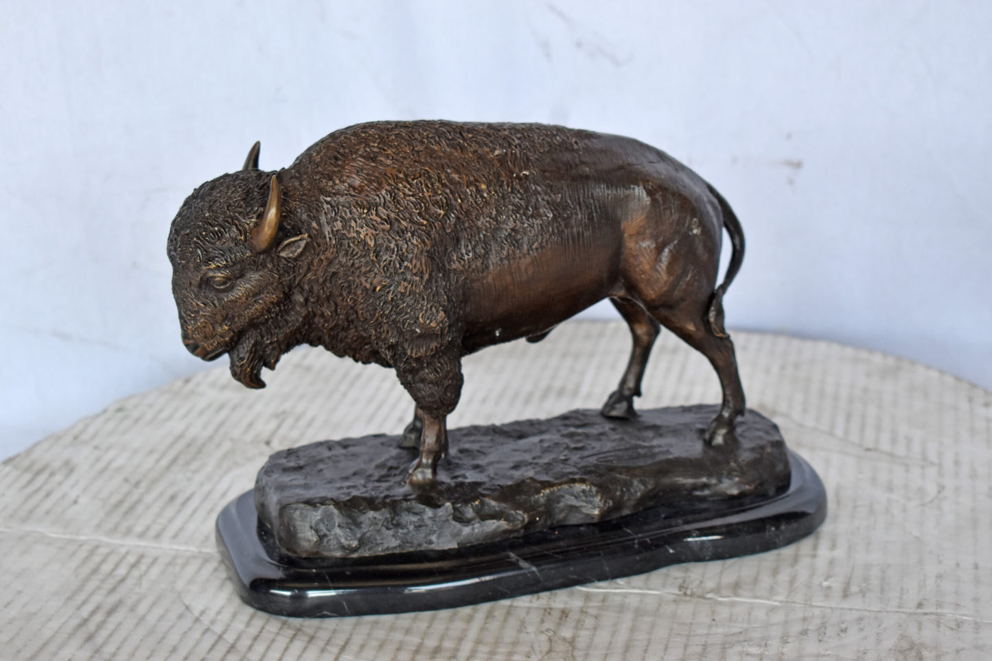 Bison standing and looking down Bronze Statue - Size: 11"L x 6"W x 8"H.