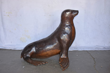Perched Life Size Seal bronze statue - Size: 40"L x 35"W x 31"H.