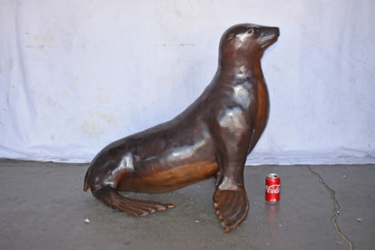 Perched Life Size Seal bronze statue - Size: 40"L x 35"W x 31"H.