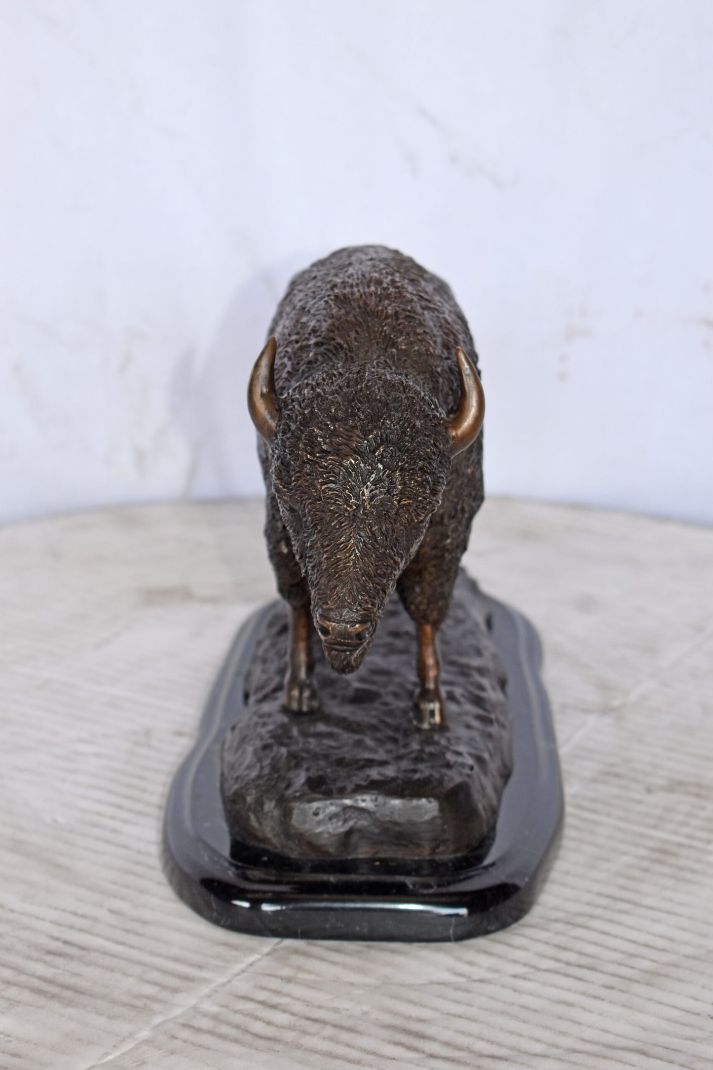 Bison standing and looking down Bronze Statue - Size: 11"L x 6"W x 8"H.