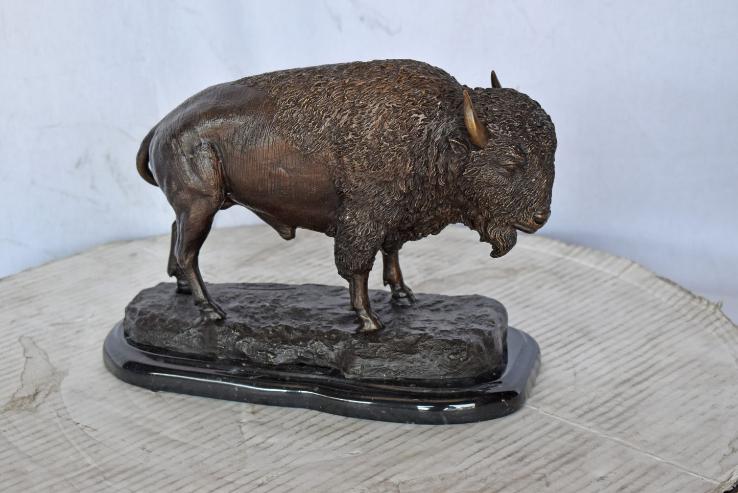 Bison standing and looking down Bronze Statue - Size: 11"L x 6"W x 8"H.