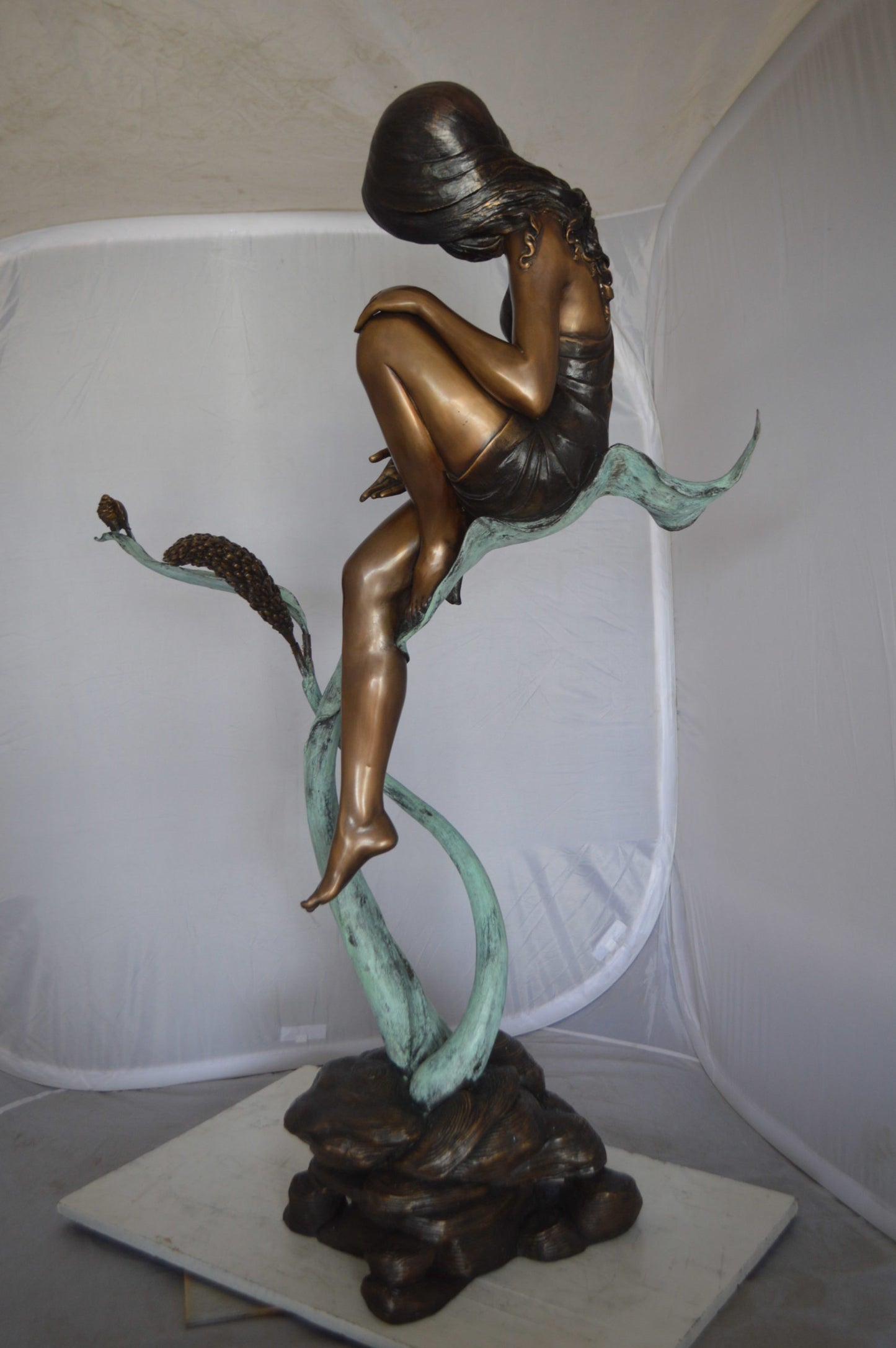 Beautiful Young Girl Sitting on a Tree Bronze Statue -  35"L x 50"W x 55"H. 