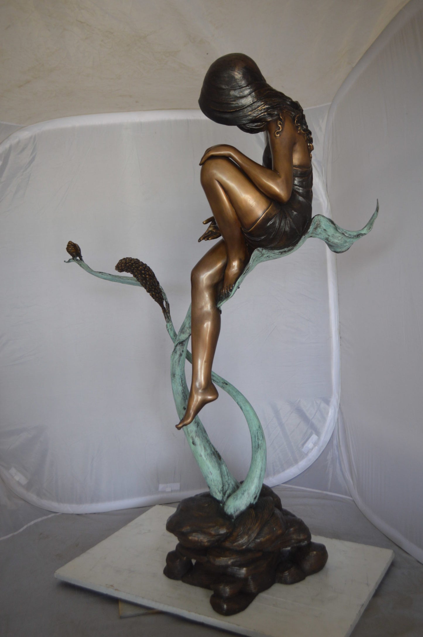 Beautiful Young Girl Sitting on a Tree Bronze Statue -  35"L x 50"W x 55"H. 