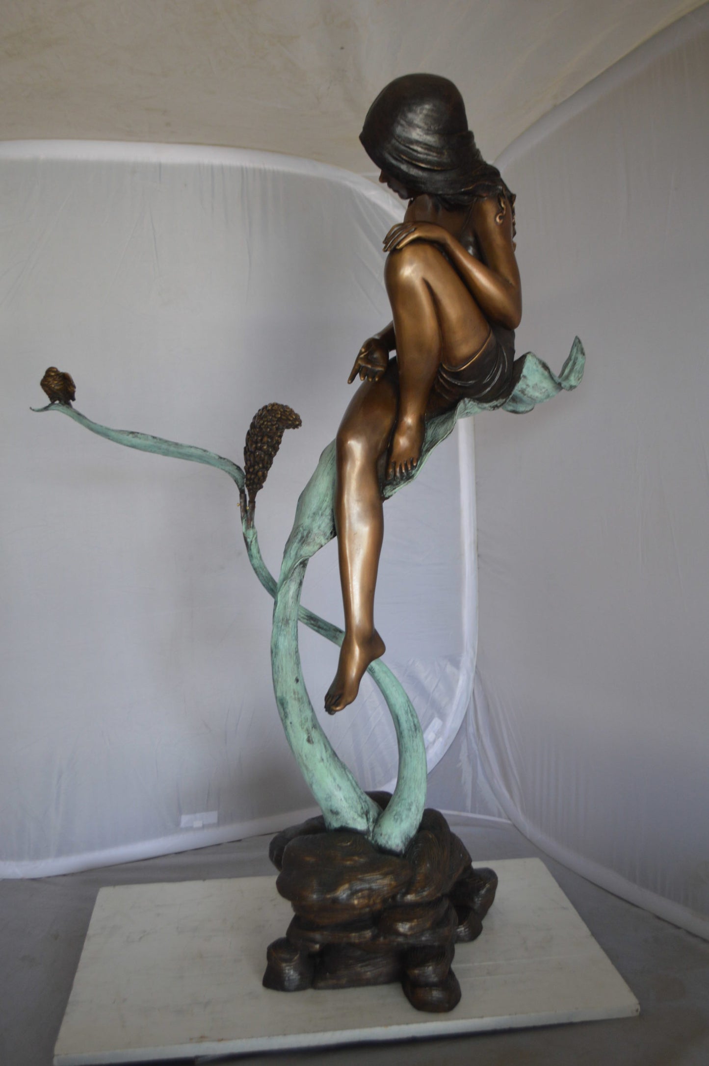 Beautiful Young Girl Sitting on a Tree Bronze Statue -  35"L x 50"W x 55"H. 