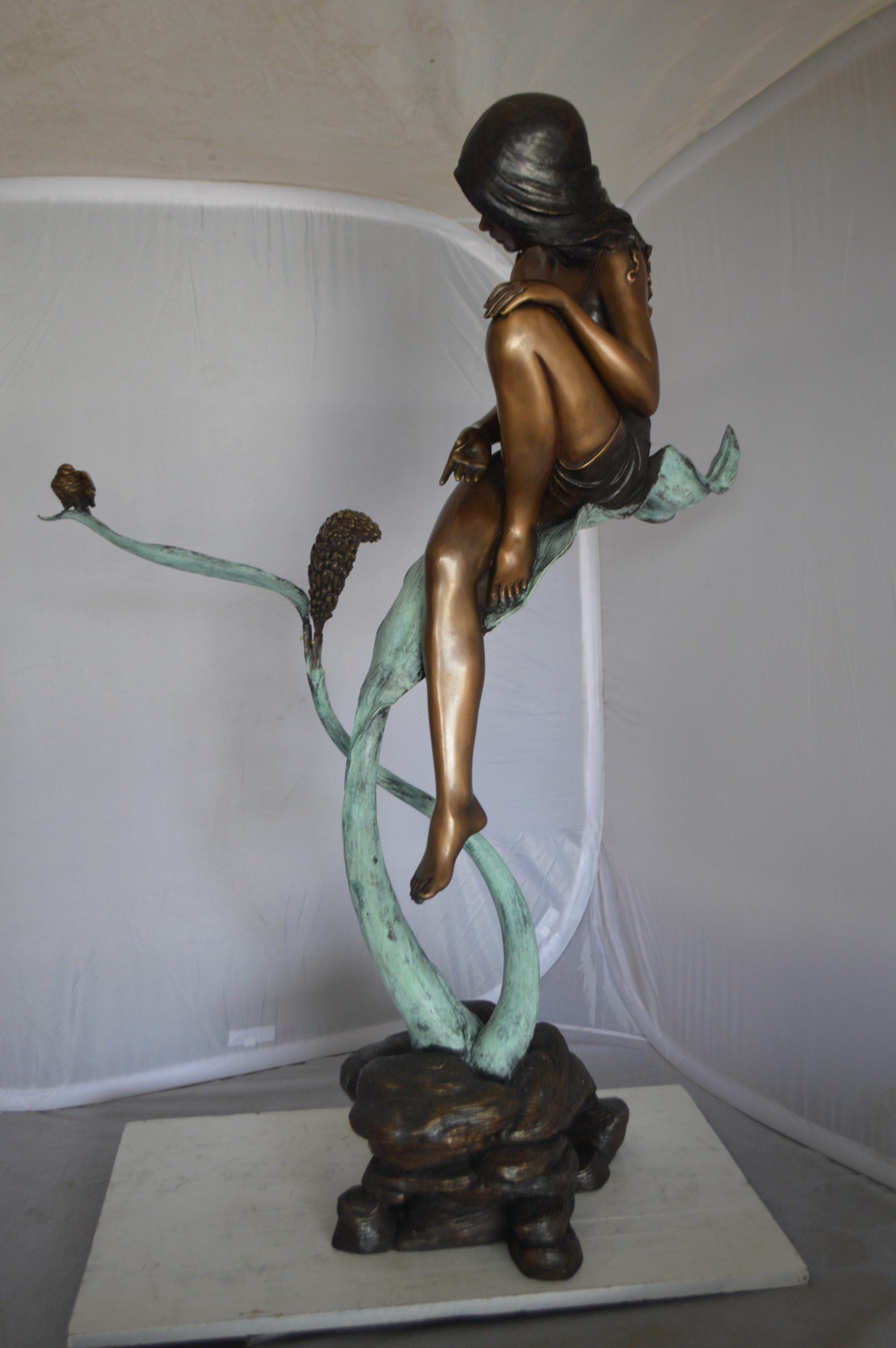 Beautiful Young Girl Sitting on a Tree Bronze Statue -  35"L x 50"W x 55"H. 
