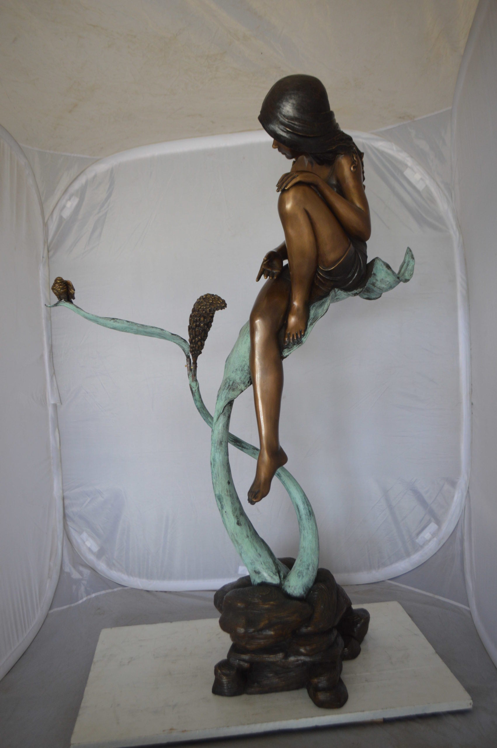 Beautiful Young Girl Sitting on a Tree Bronze Statue -  35"L x 50"W x 55"H. 