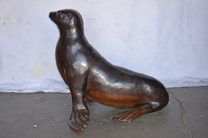 Perched Life Size Seal bronze statue - Size: 40"L x 35"W x 31"H.