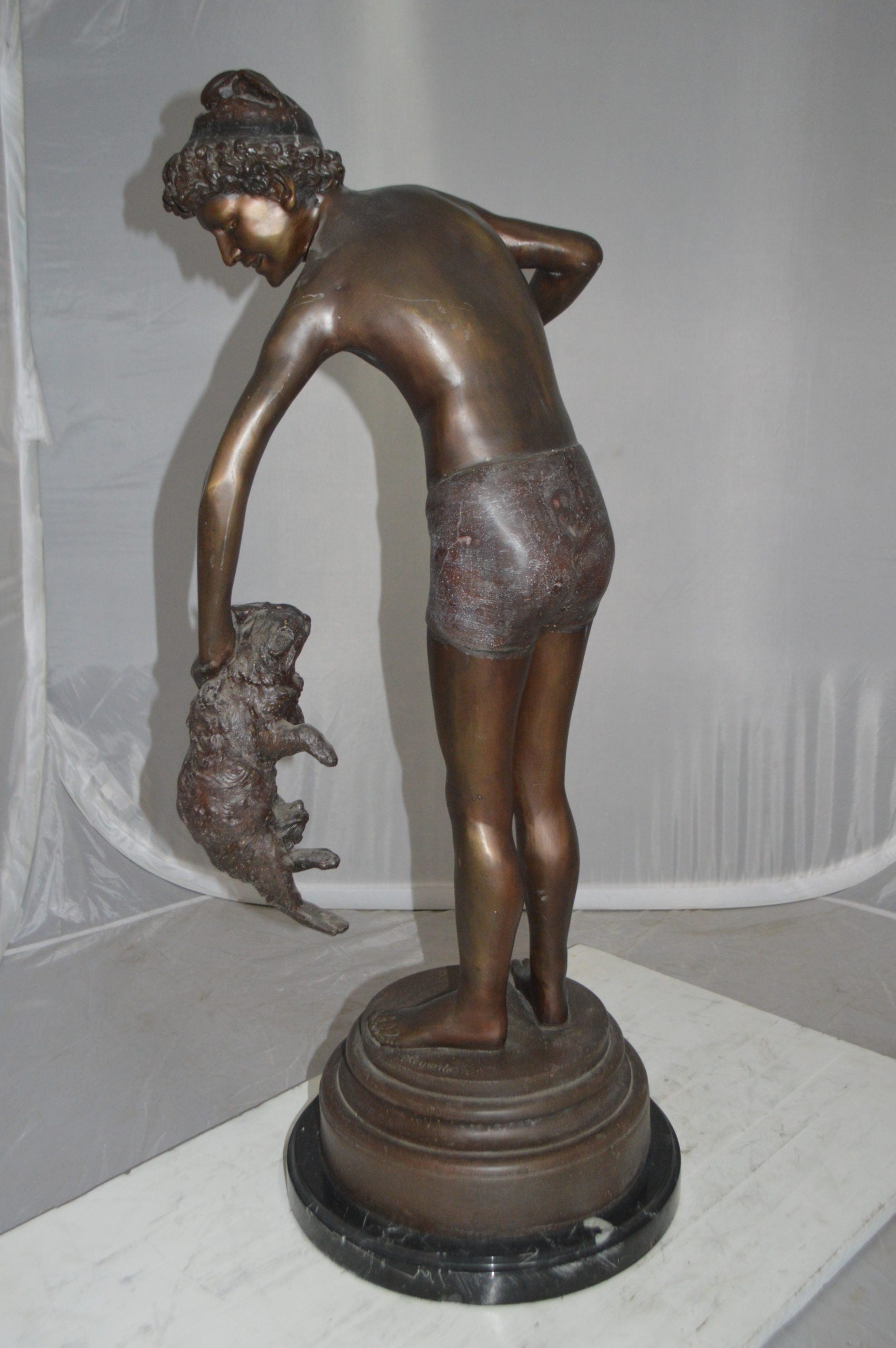 Boy holding a Dog and a Bird Bronze Statue -  Size: 15"L x 15"W x 36"H. 