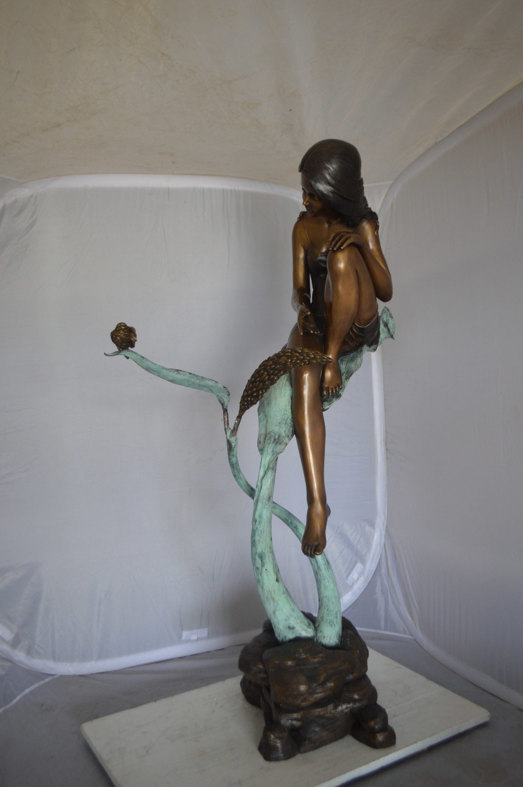 Beautiful Young Girl Sitting on a Tree Bronze Statue -  35"L x 50"W x 55"H. 