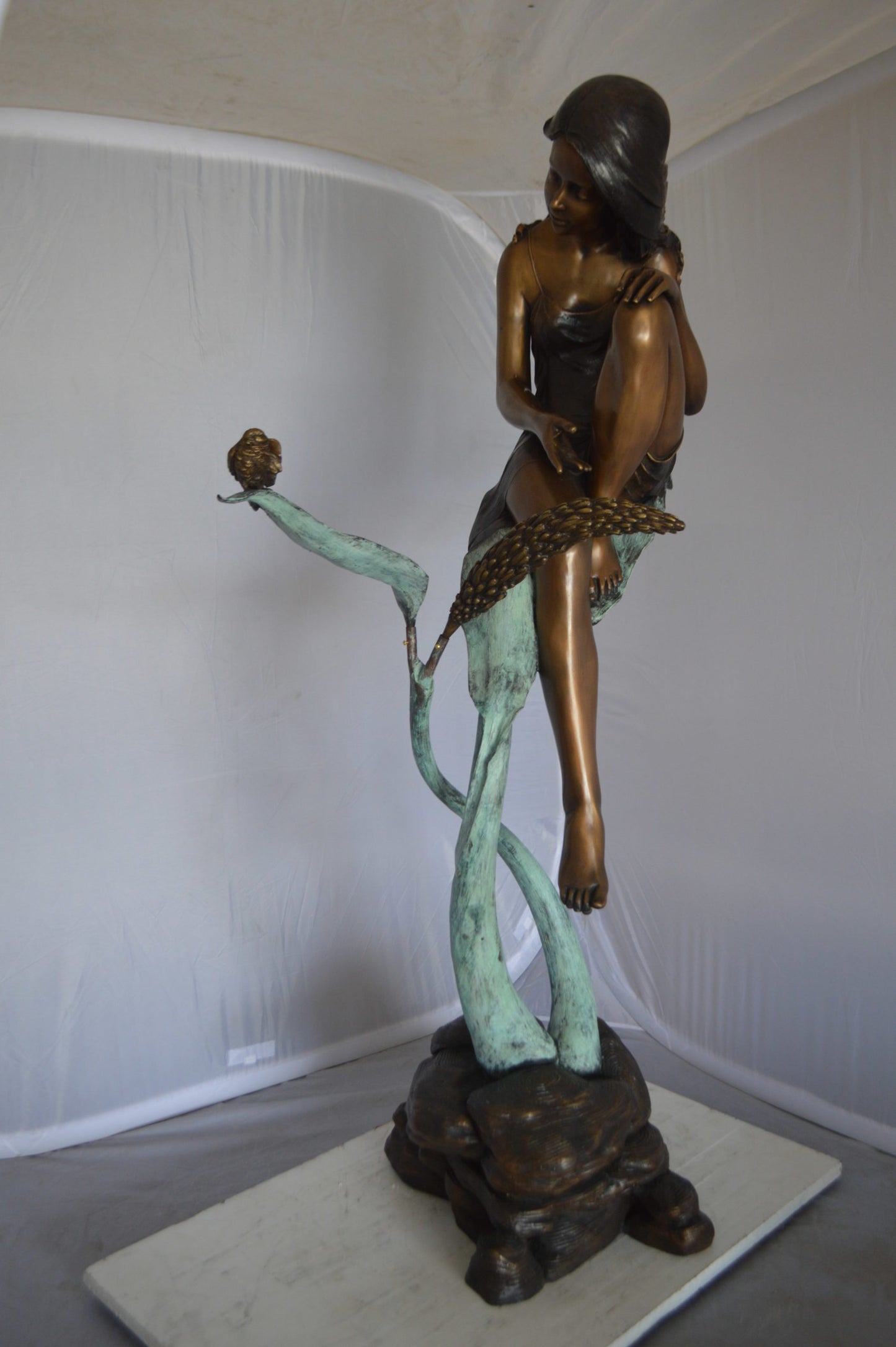 Beautiful Young Girl Sitting on a Tree Bronze Statue -  35"L x 50"W x 55"H. 