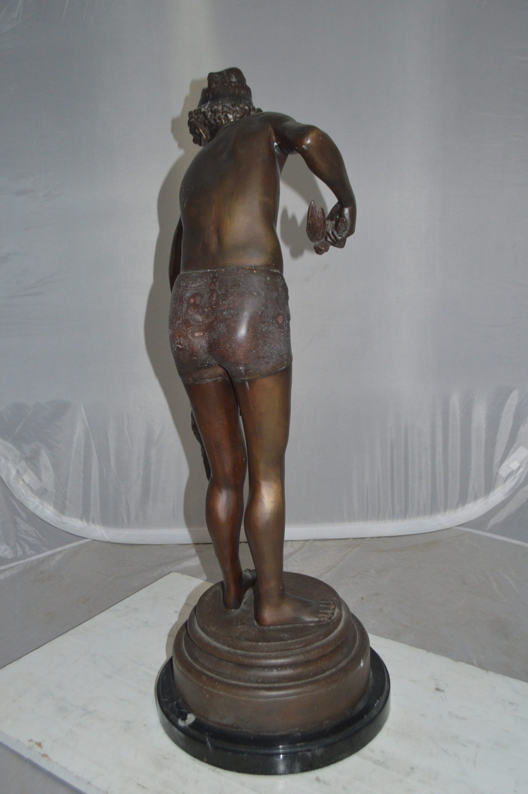 Boy holding a Dog and a Bird Bronze Statue -  Size: 15"L x 15"W x 36"H. 