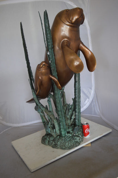 Two Large Manatees swimming Bronze Fountain Statue -  Size: 23"L x 42"W x 42"H. 