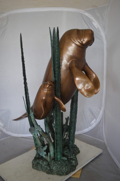 Two Large Manatees swimming Bronze Fountain Statue -  Size: 23"L x 42"W x 42"H. 