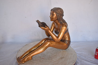 Young Beautiful Girl Helping A Bird Fly - Size: 22"L x 7"W x 18"H.
