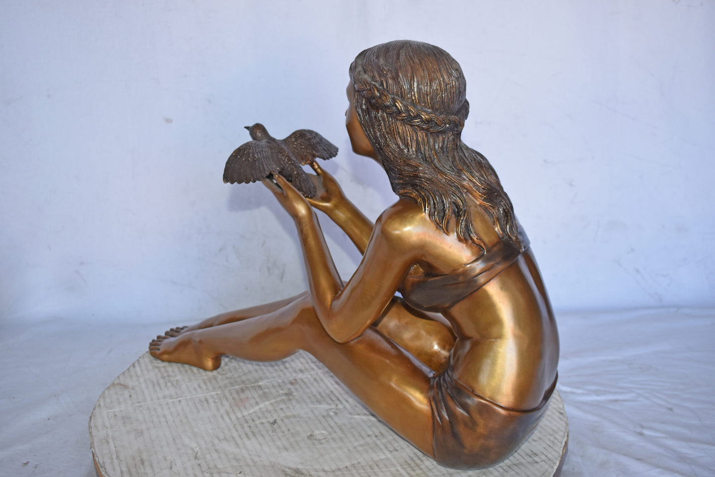 Young Beautiful Girl Helping A Bird Fly - Size: 22"L x 7"W x 18"H.