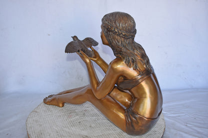 Young Beautiful Girl Helping A Bird Fly - Size: 22"L x 7"W x 18"H.
