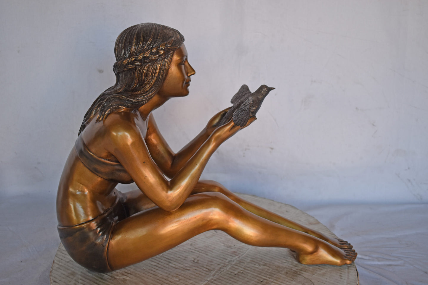 Young Beautiful Girl Helping A Bird Fly - Size: 22"L x 7"W x 18"H.
