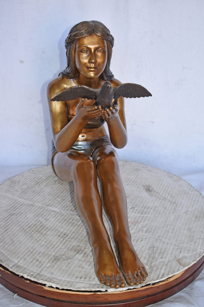 Young Beautiful Girl Helping A Bird Fly - Size: 22"L x 7"W x 18"H.