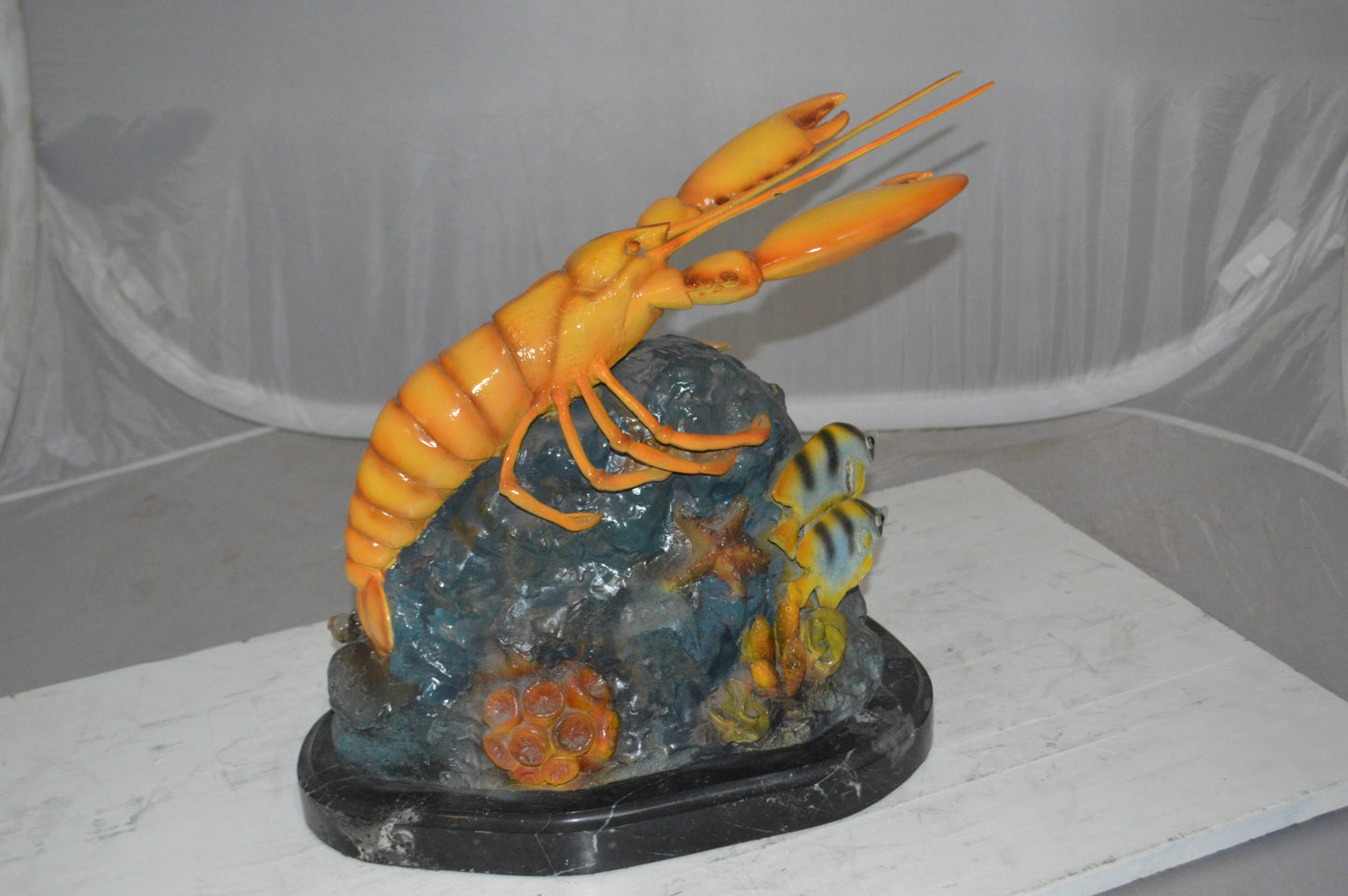 Lobster with Fish Bronze Statue -  Size: 9"L x 18"W x 16"H. 