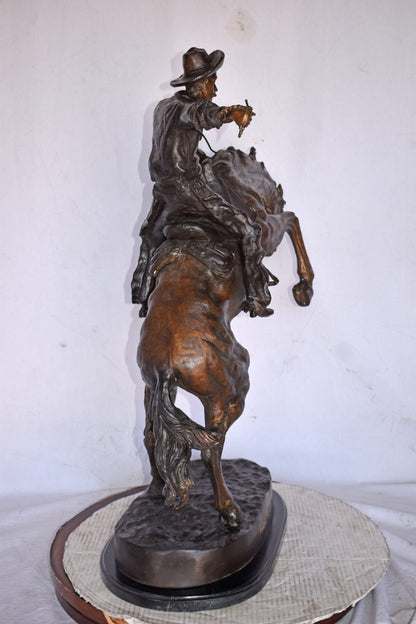 Bronco Buster by Remington Replica Bronze Statue - Size: 31"L x 17"W x 36"H.