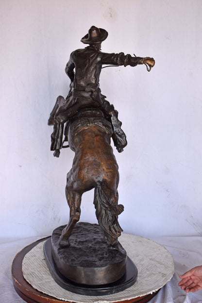 Bronco Buster by Remington Replica Bronze Statue - Size: 31"L x 17"W x 36"H.