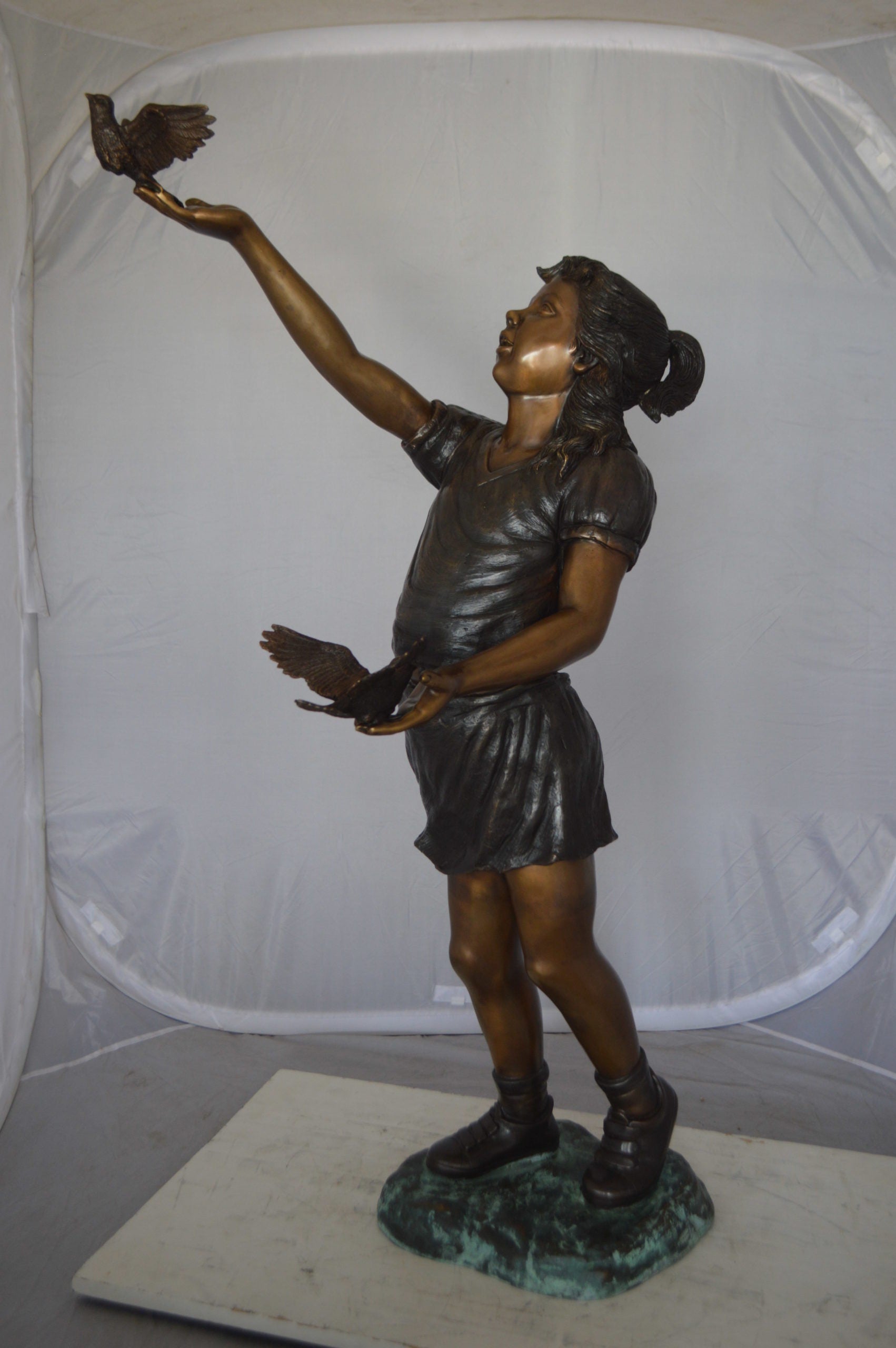 Girl - sandy, with two birds Bronze Statue -  Size: 25"L x 20"W x 42"H. 