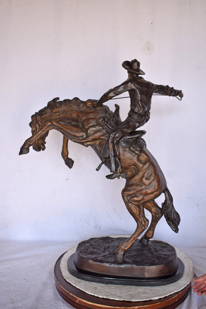 Bronco Buster by Remington Replica Bronze Statue - Size: 31"L x 17"W x 36"H.