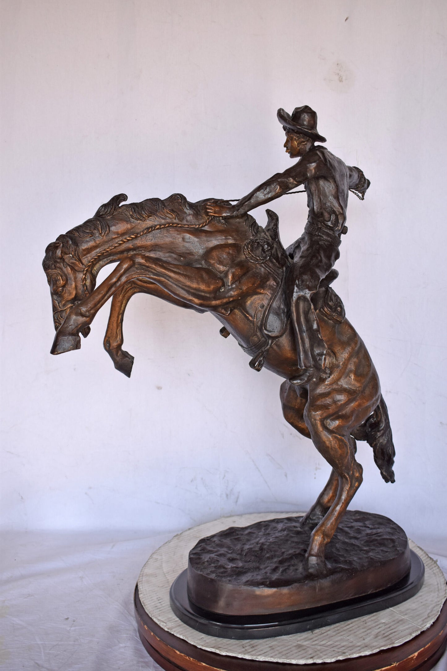 Bronco Buster by Remington Replica Bronze Statue - Size: 31"L x 17"W x 36"H.