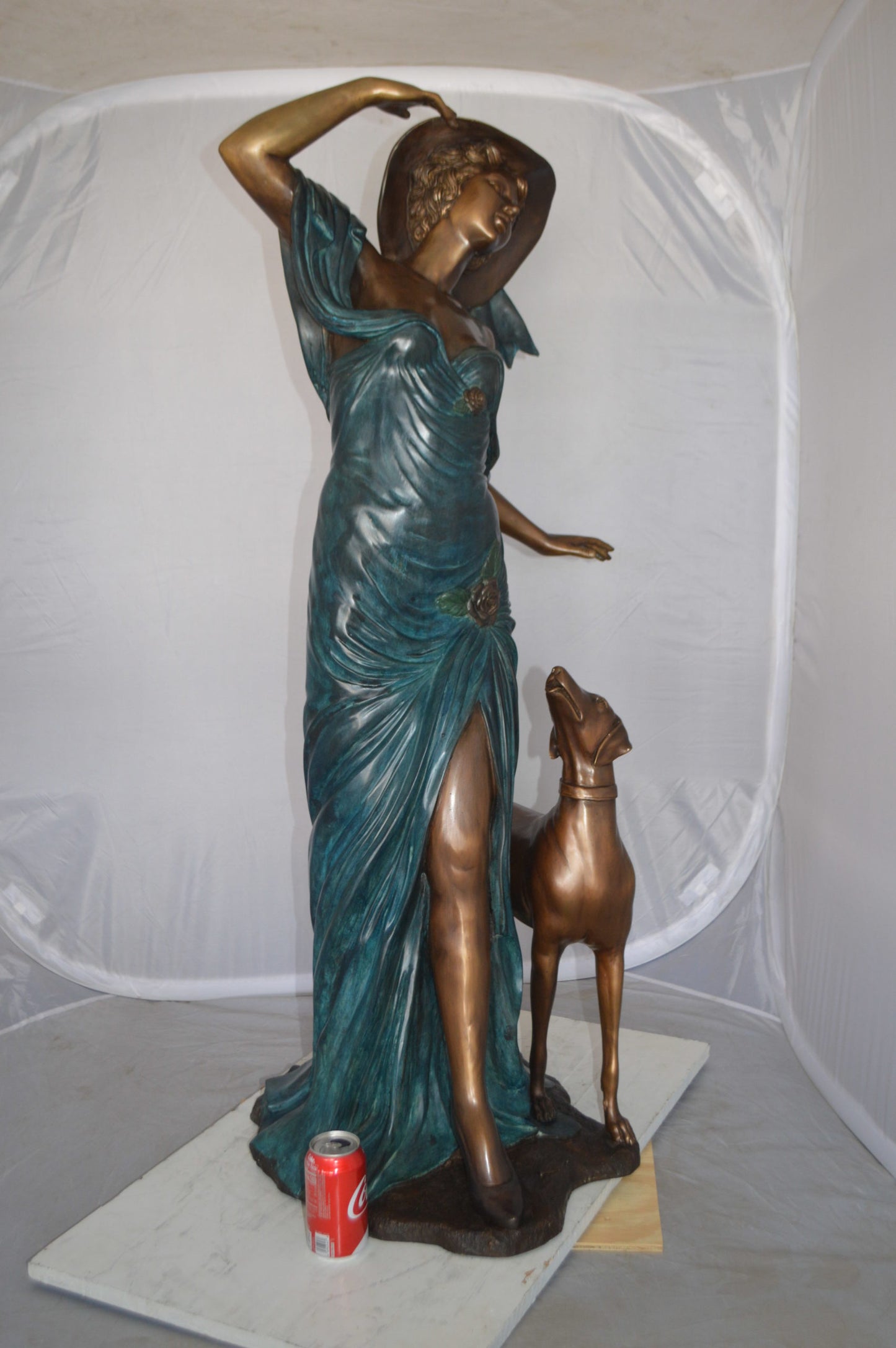 Lady With Her Dog Bronze Statue -  Size: 25"L x 22"W x 50"H. 