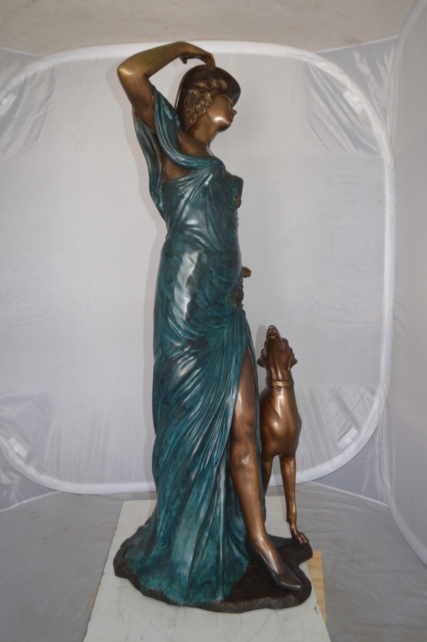 Lady With Her Dog Bronze Statue -  Size: 25"L x 22"W x 50"H. 