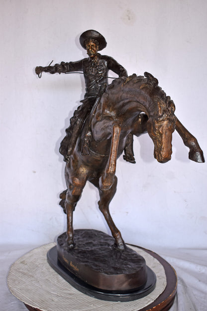 Bronco Buster by Remington Replica Bronze Statue - Size: 31"L x 17"W x 36"H.