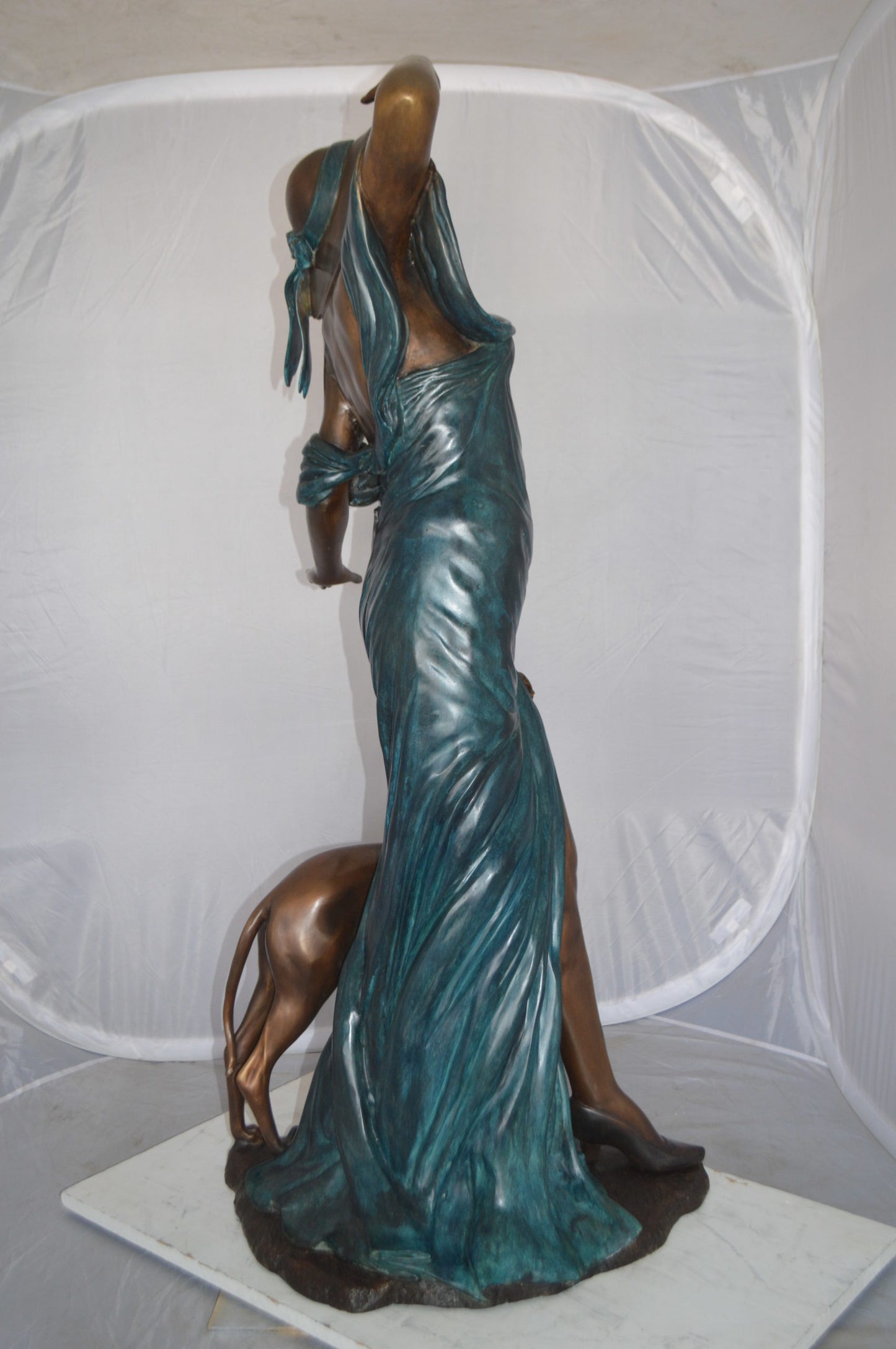 Lady With Her Dog Bronze Statue -  Size: 25"L x 22"W x 50"H. 