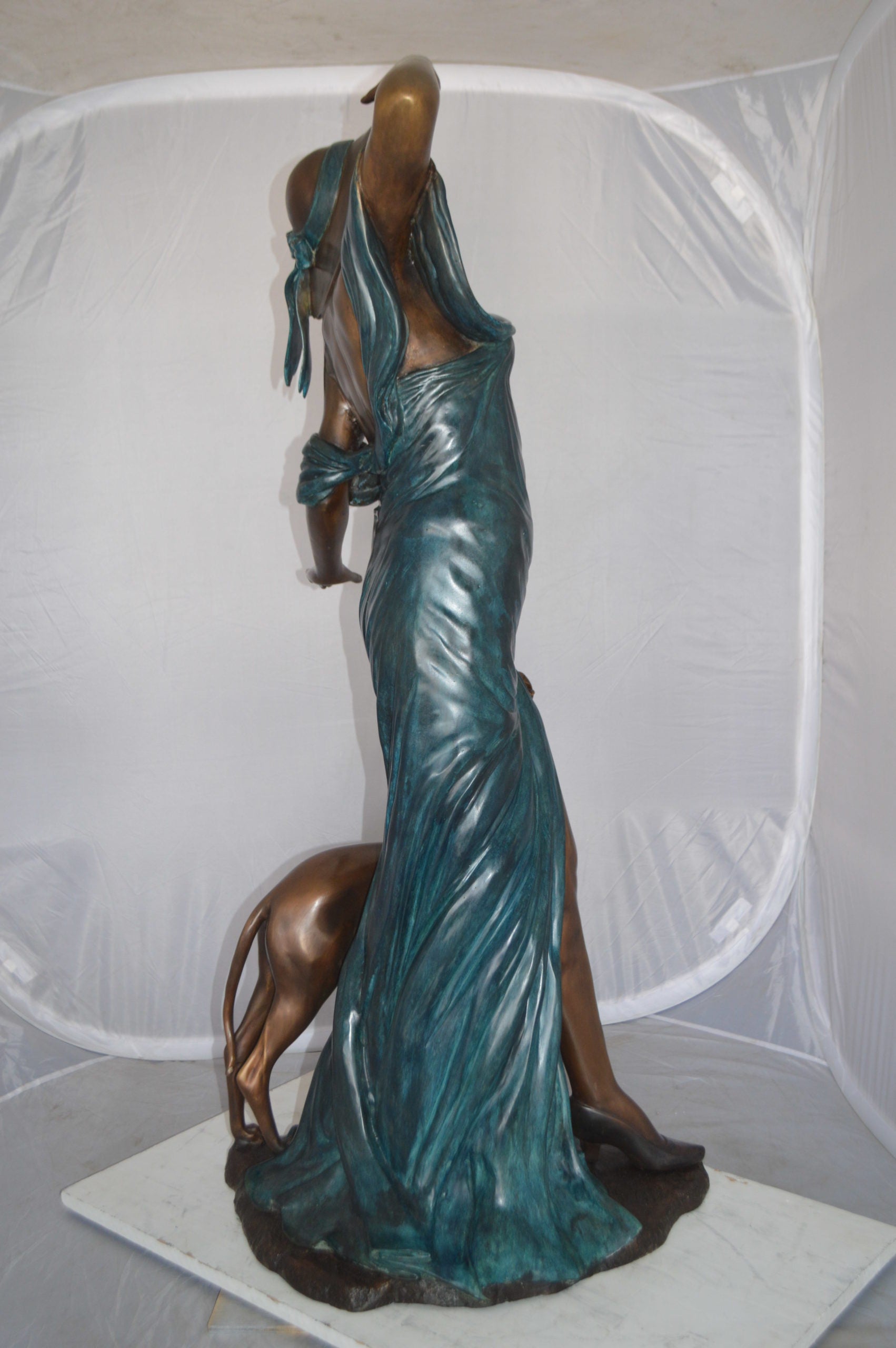 Lady With Her Dog Bronze Statue -  Size: 25"L x 22"W x 50"H. 