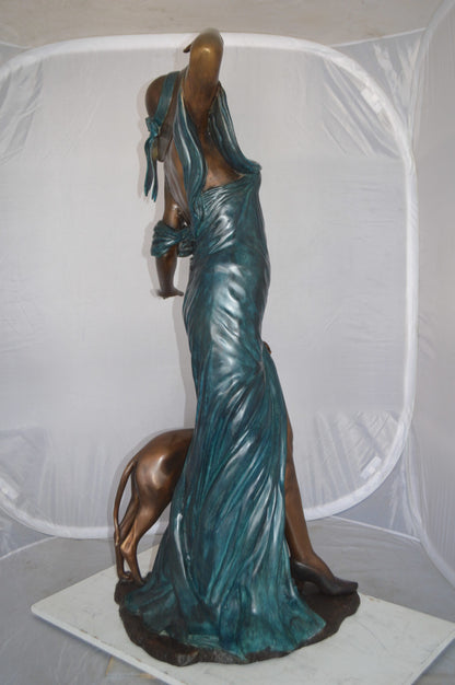 Lady With Her Dog Bronze Statue -  Size: 25"L x 22"W x 50"H. 
