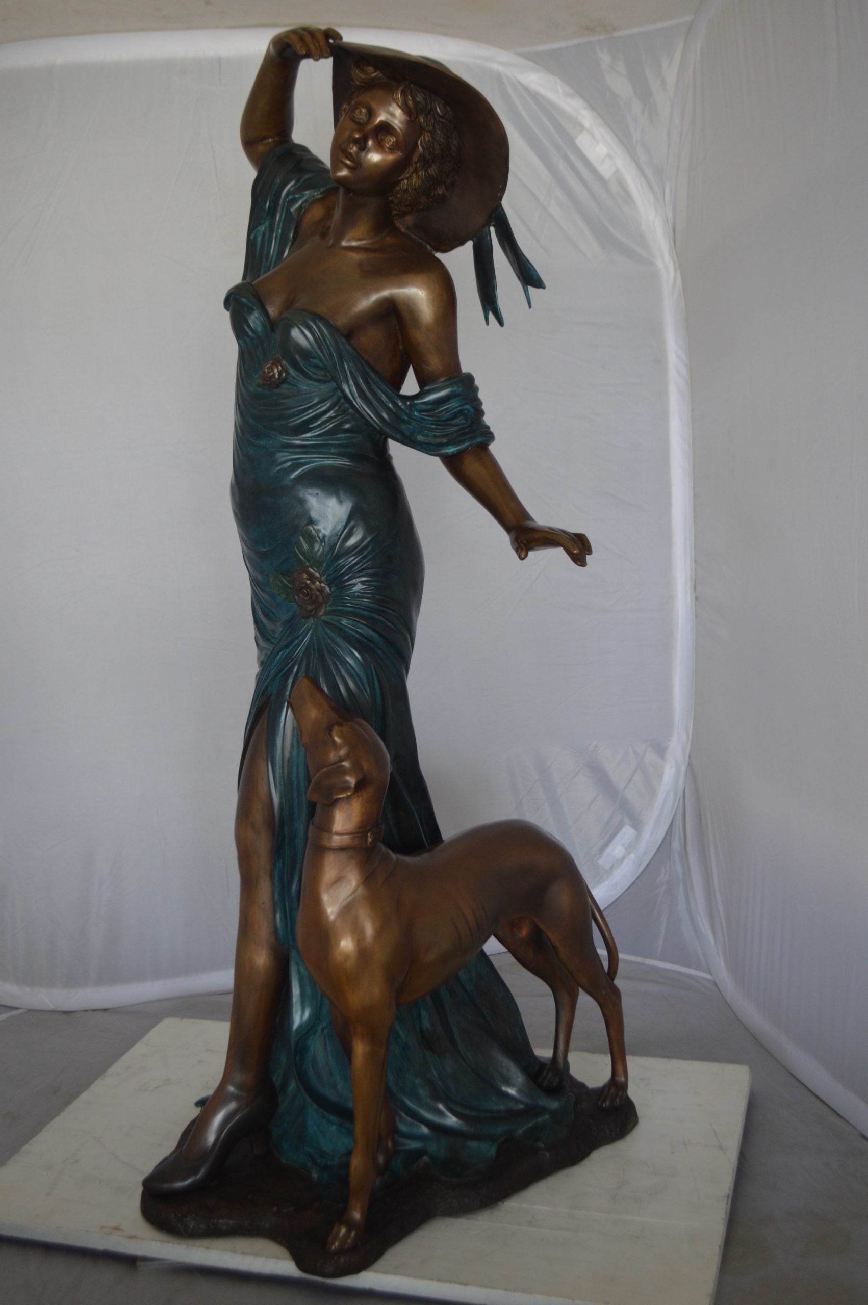 Lady With Her Dog Bronze Statue -  Size: 25"L x 22"W x 50"H. 