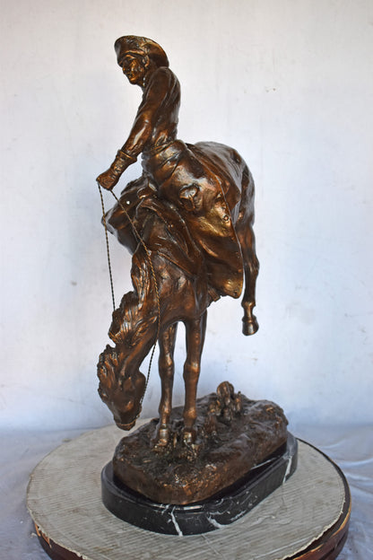 Outlaw by Remington Bronze Statue Replica - Size: 18"L x 10"W x 32"H.