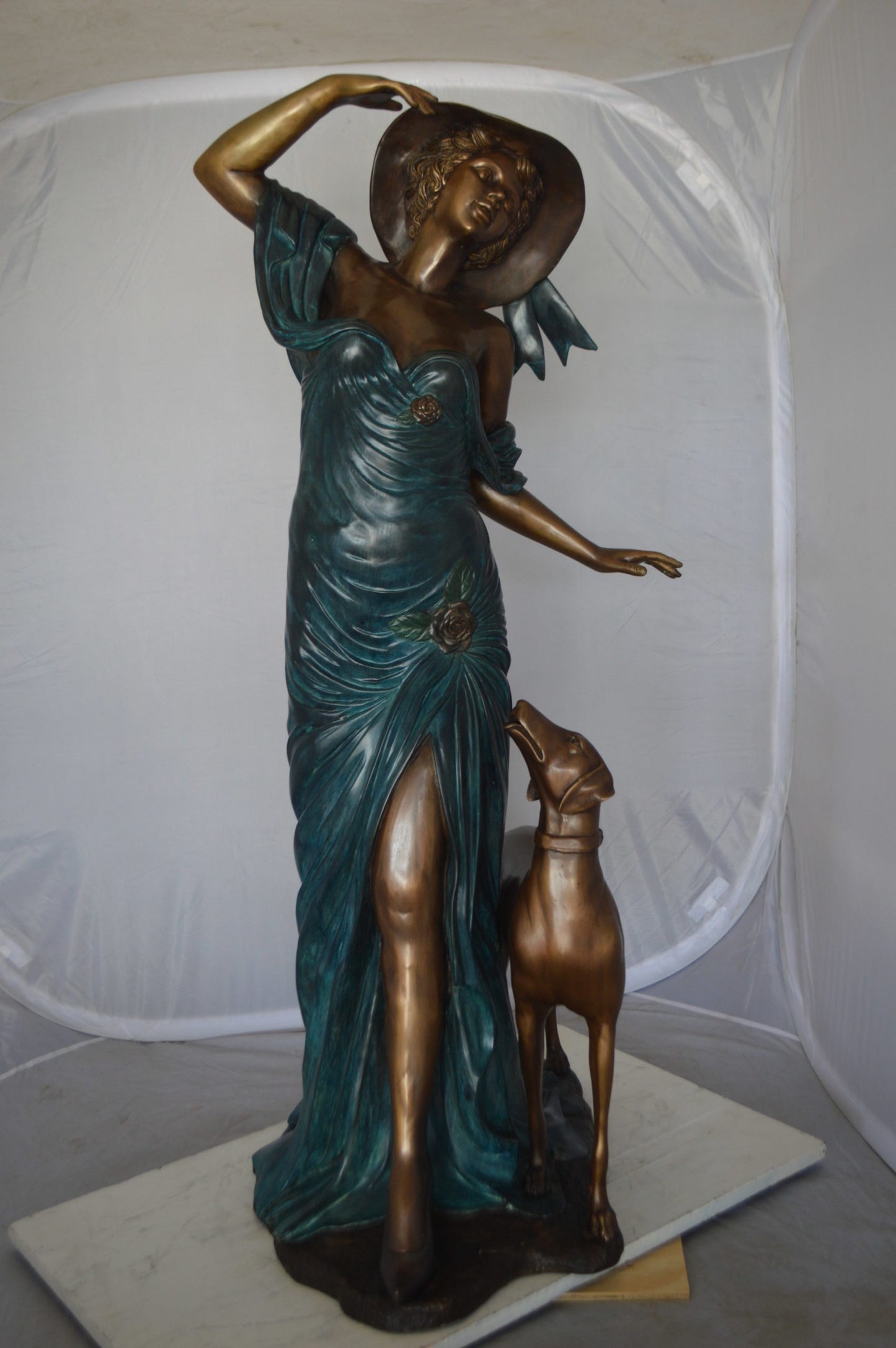 Lady With Her Dog Bronze Statue -  Size: 25"L x 22"W x 50"H. 