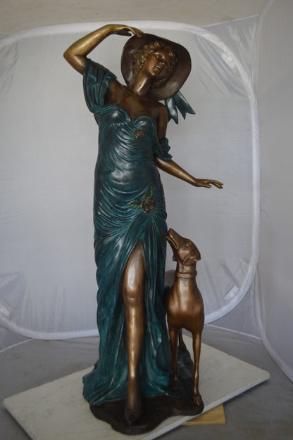 Lady With Her Dog Bronze Statue -  Size: 25"L x 22"W x 50"H. 