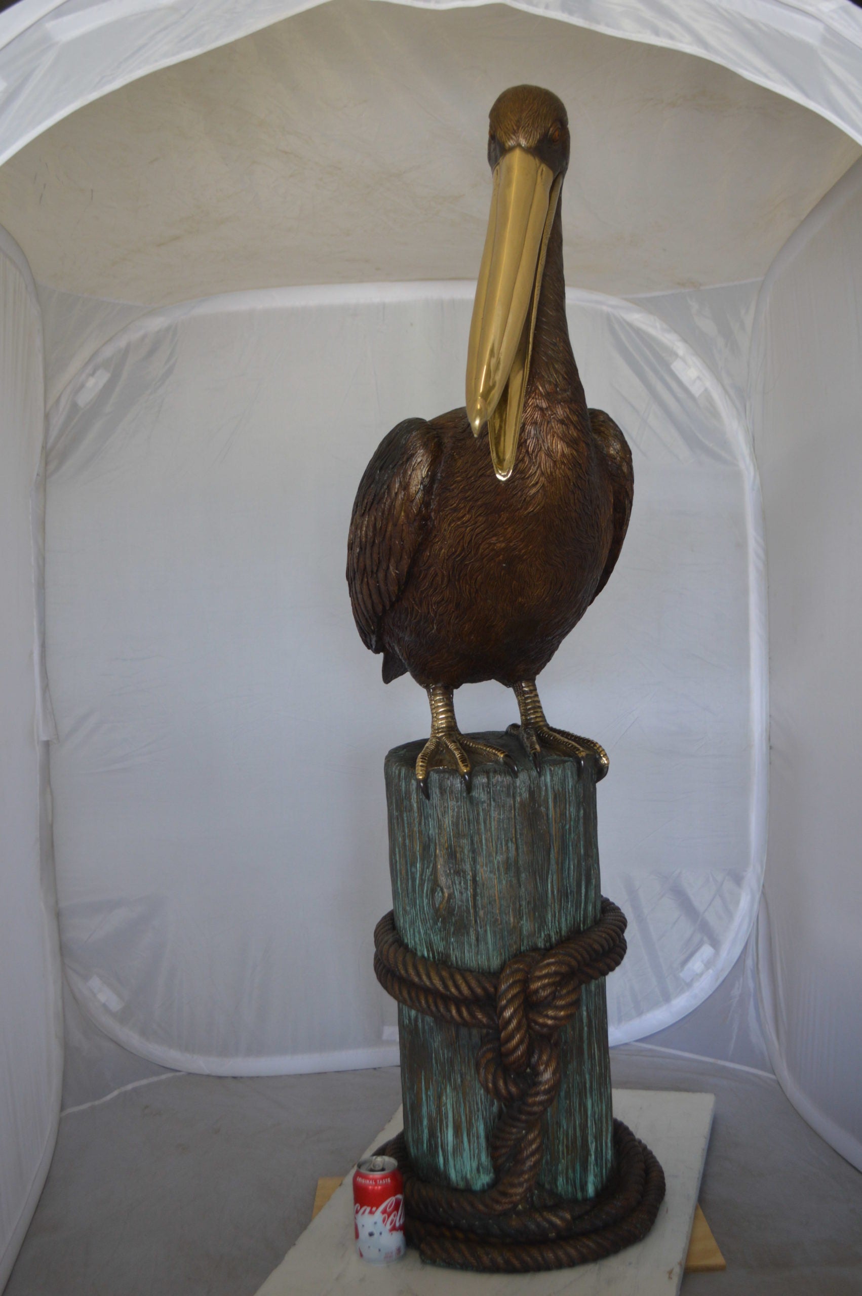 Pelican on a Stump Bronze Statue -  Size: 14"L x 38"W x 58"H. 