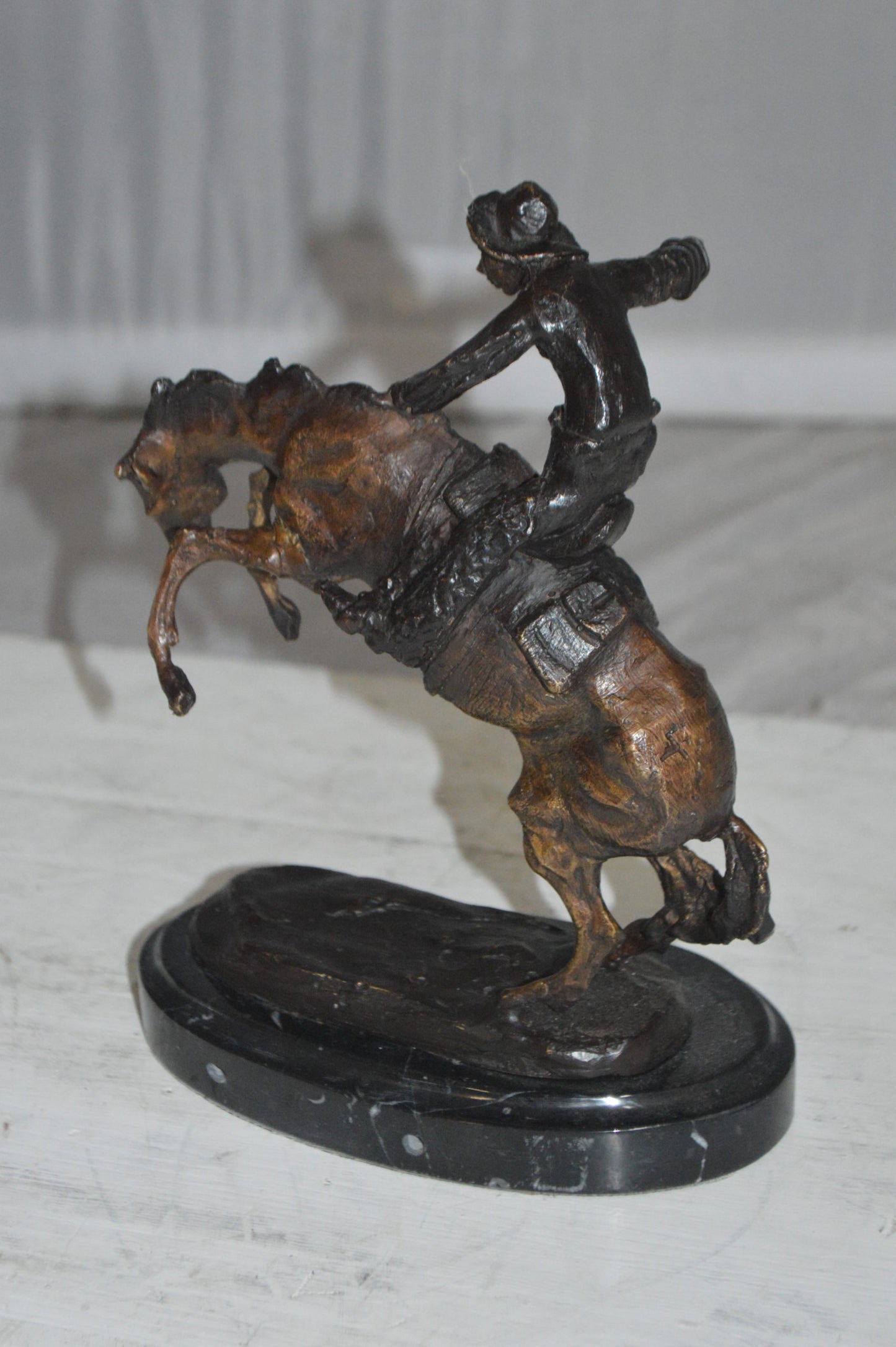 Bronco Buster by Remington Bronze Statue -  3" x 7" x 10"H. 