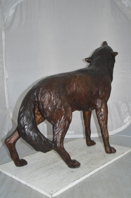 Howling Wolf Bronze Statue -  Size: 40"L x 10"W x 32"H.