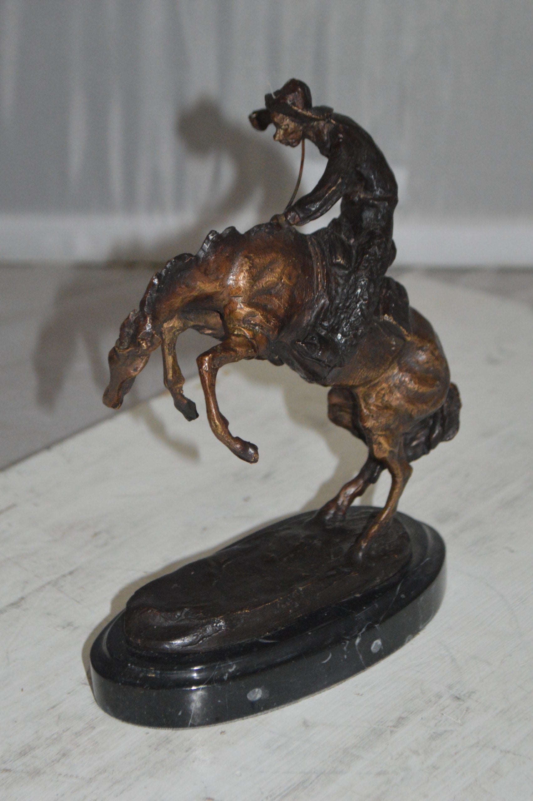 Bronco Buster by Remington Bronze Statue -  3" x 7" x 10"H. 