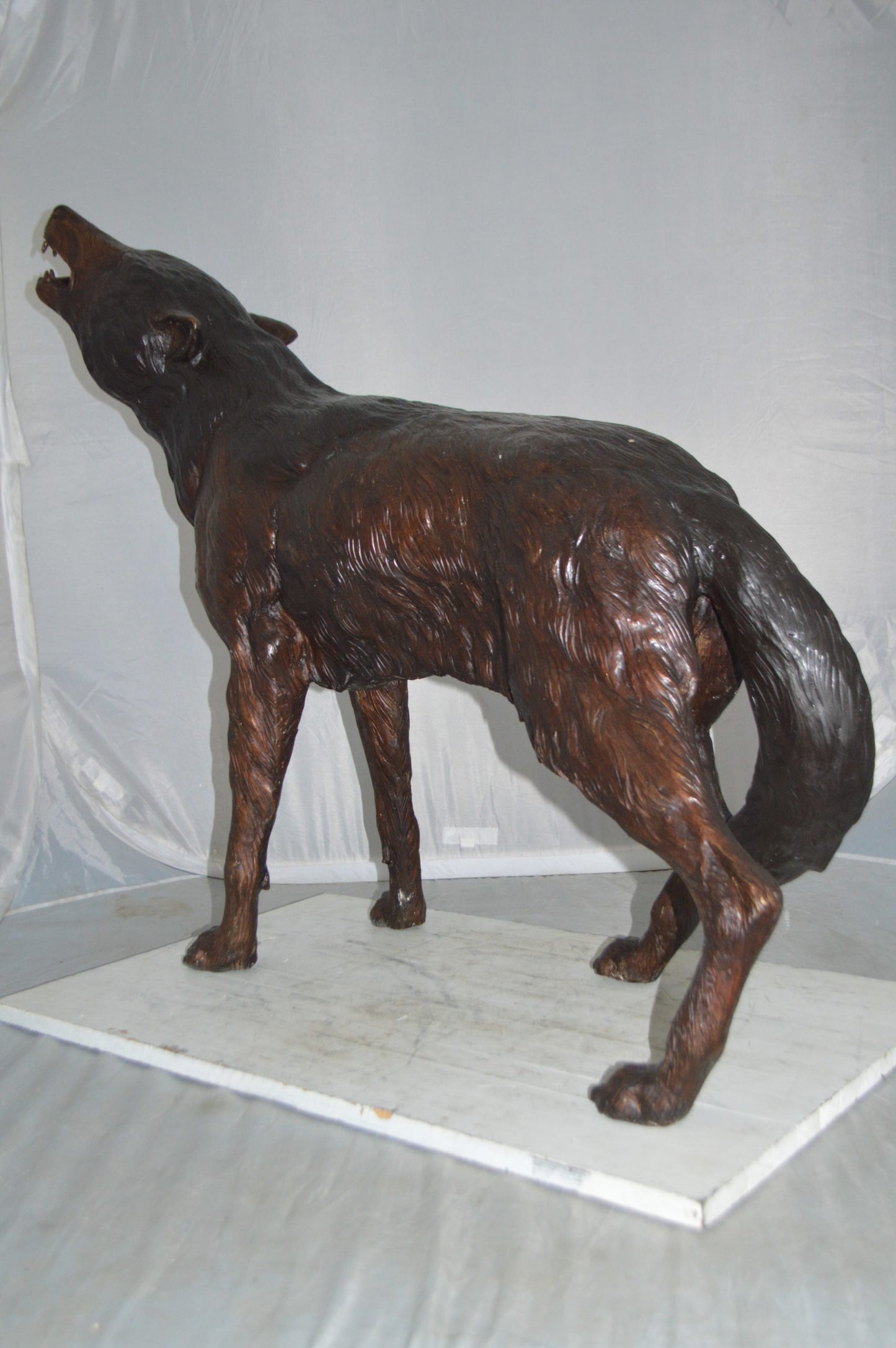 Howling Wolf Bronze Statue -  Size: 40"L x 10"W x 32"H.